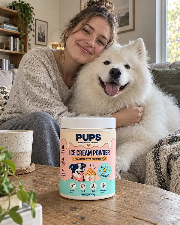 A dog parent hugging her Samoyed next to a tub of PUPS